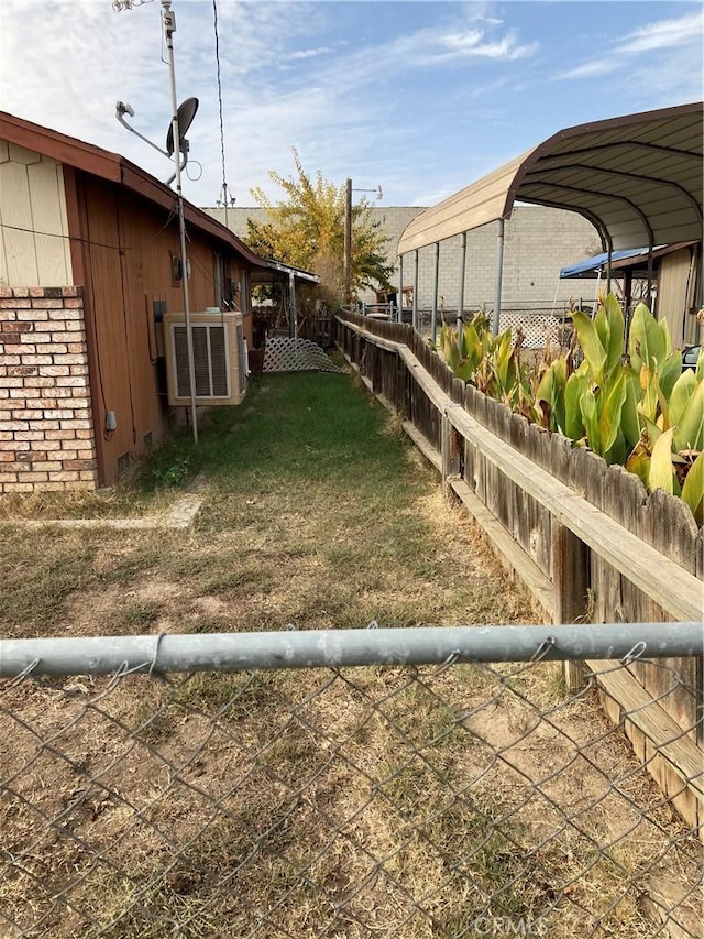 view of yard with fence private yard and central AC