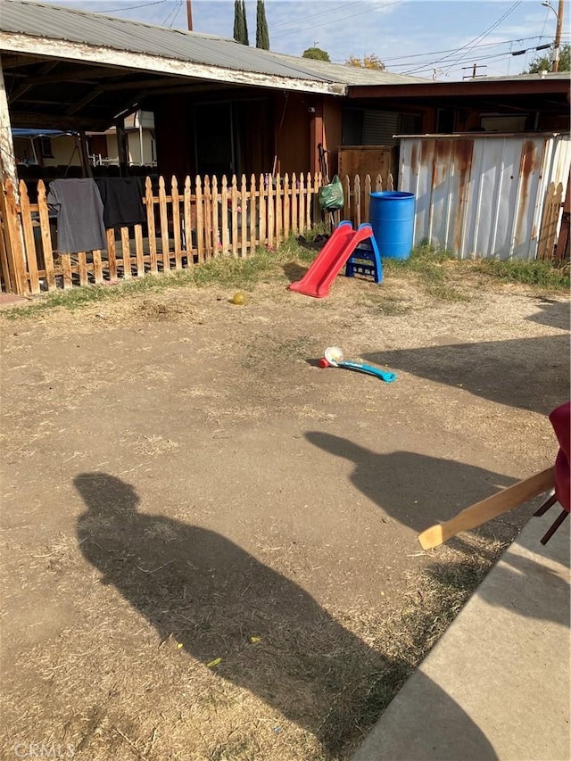 view of play area with an outbuilding and an exterior structure