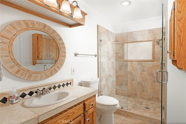 full bath featuring toilet, ornamental molding, tile patterned flooring, vanity, and a shower stall