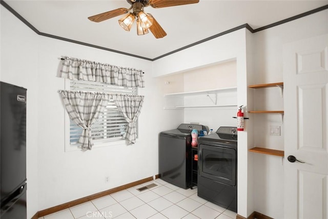 washroom with laundry area, crown molding, and washing machine and clothes dryer