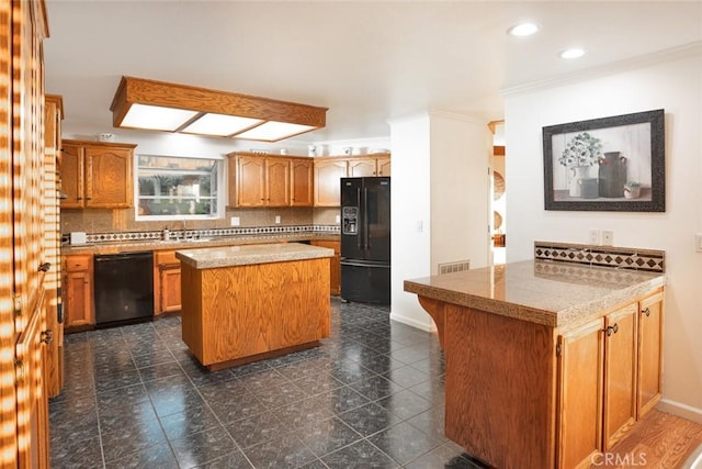 kitchen with a skylight, a center island, visible vents, decorative backsplash, and black appliances