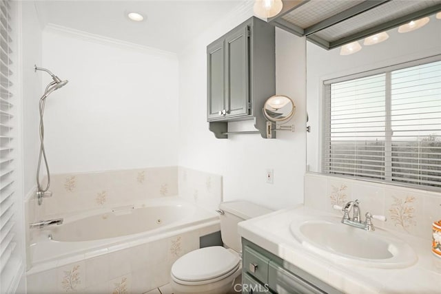 full bathroom with toilet, tiled tub, ornamental molding, and vanity