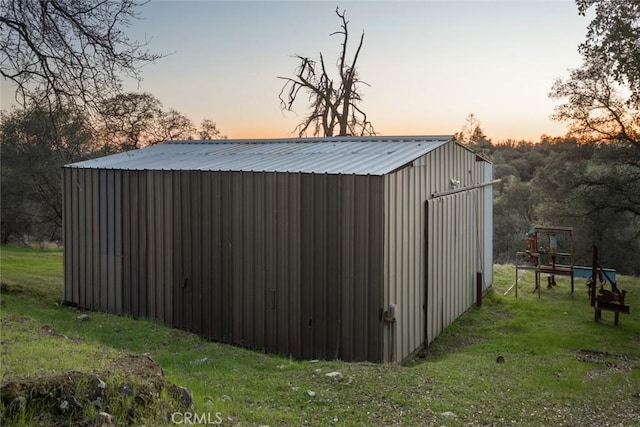 view of pole building with a yard