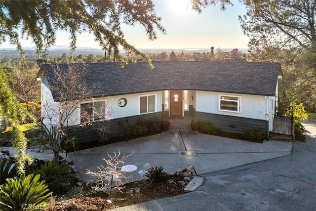 view of front of home featuring a shingled roof