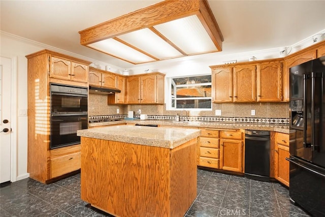 kitchen featuring under cabinet range hood, a sink, light countertops, backsplash, and black appliances