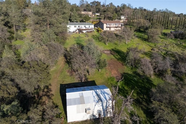 bird's eye view featuring a forest view