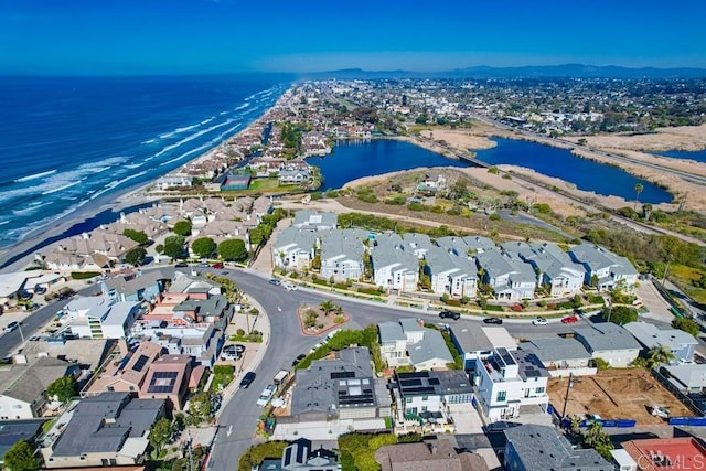 birds eye view of property featuring a water view and a residential view