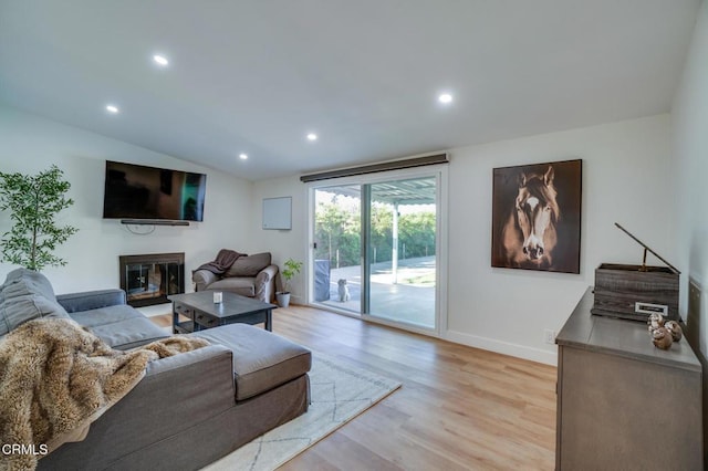 709 Greenbank Ave, Duarte, CA 91010 - living area featuring baseboards, a glass covered fireplace, vaulted ceiling, light wood-type flooring, and recessed lighting