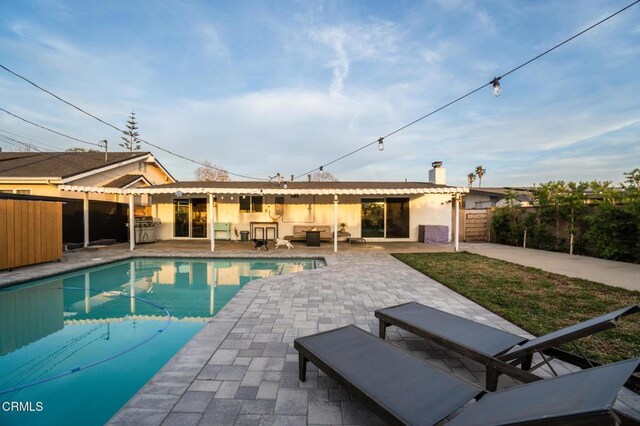 709 Greenbank Ave, Duarte, CA 91010 - back of house featuring an outdoor pool, a chimney, fence, a patio area, and outdoor lounge area
