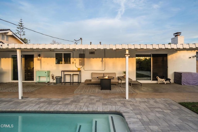 709 Greenbank Ave, Duarte, CA 91010 - rear view of house featuring an outdoor pool, an outdoor fire pit, a patio area, and stucco siding