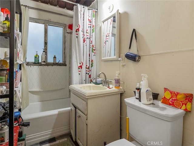 full bathroom with toilet, shower / tub combo with curtain, and vanity