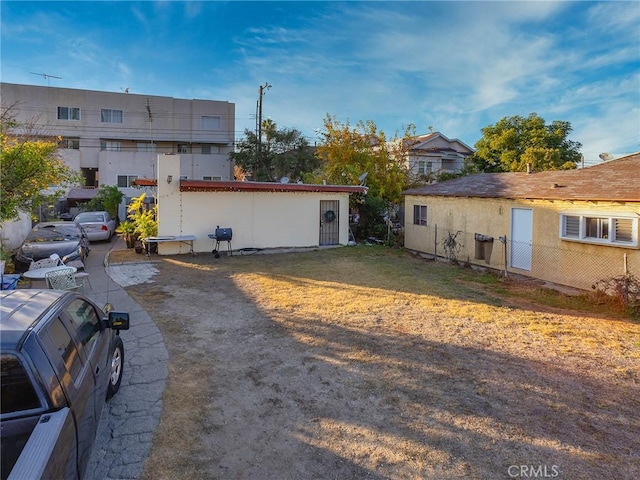 rear view of property with stucco siding