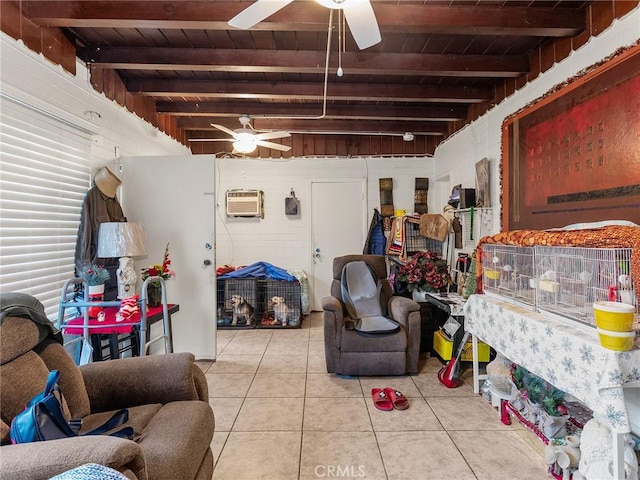 basement featuring ceiling fan, an AC wall unit, light tile patterned flooring, and wooden ceiling