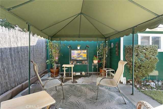 view of patio / terrace featuring fence and a gazebo