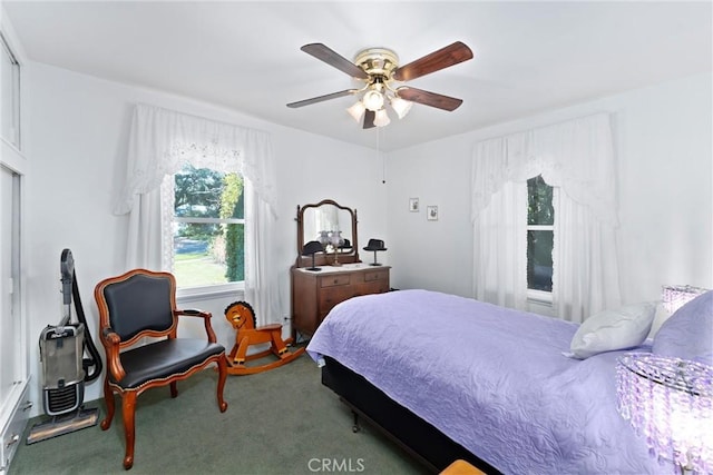 carpeted bedroom with a ceiling fan