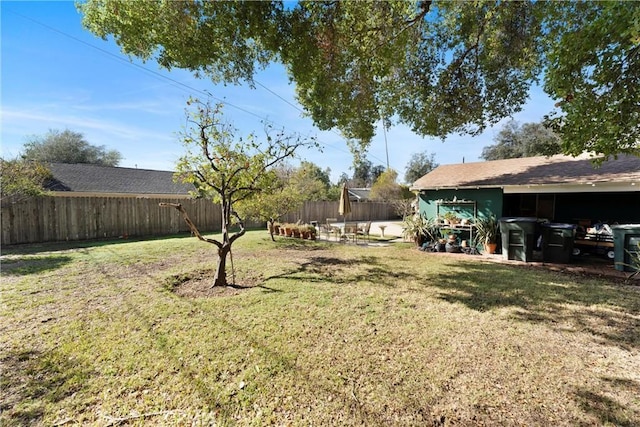 view of yard with a fenced backyard