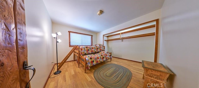 living area featuring wood finished floors and lofted ceiling