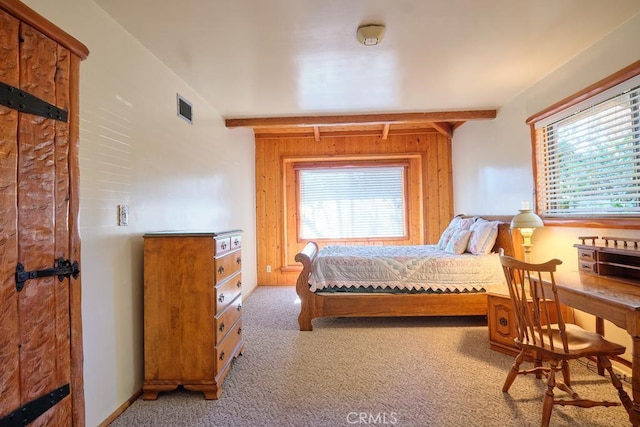 bedroom with carpet flooring, visible vents, and multiple windows
