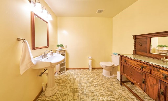 bathroom with visible vents, toilet, baseboards, and tile patterned floors