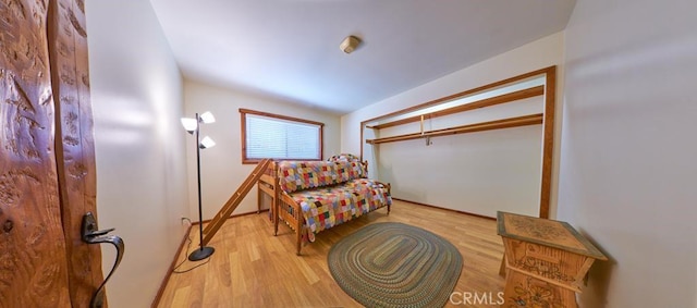 living area featuring wood finished floors and lofted ceiling