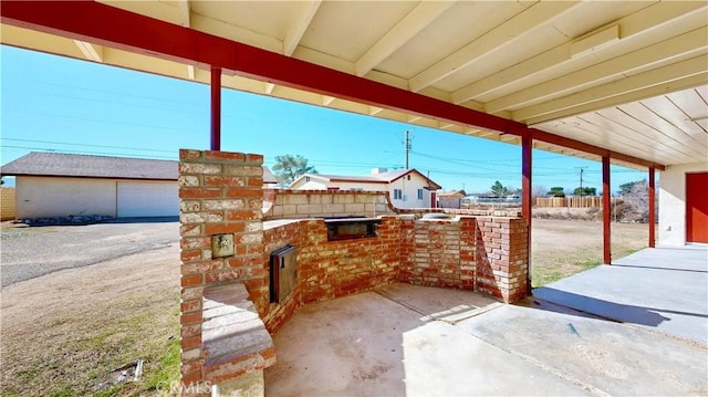 view of patio featuring fence