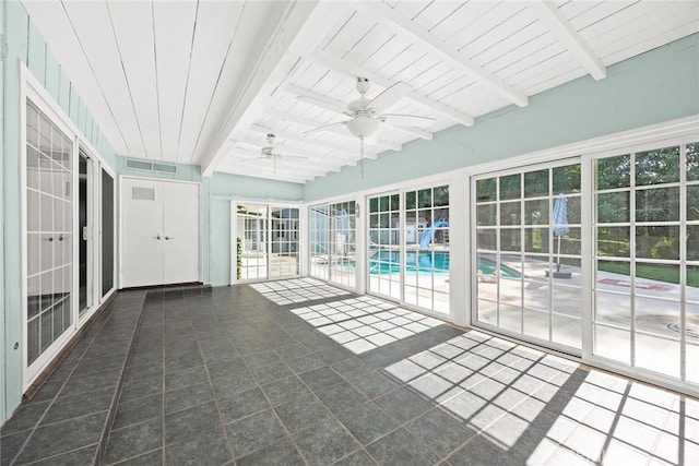 unfurnished sunroom featuring wooden ceiling, visible vents, beamed ceiling, and ceiling fan