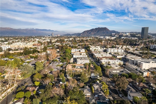 birds eye view of property featuring a view of city and a mountain view