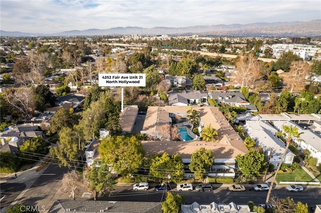 drone / aerial view with a residential view and a mountain view