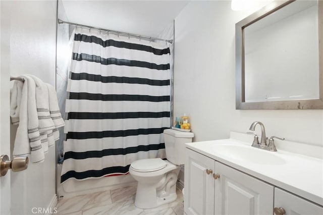 bathroom featuring toilet, marble finish floor, curtained shower, and vanity