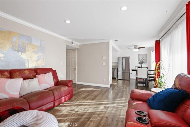 living room featuring ornamental molding, recessed lighting, visible vents, and dark wood-style floors