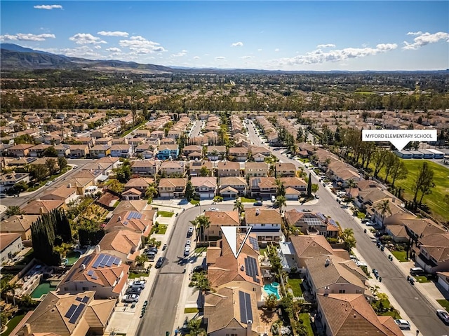 birds eye view of property with a residential view and a mountain view