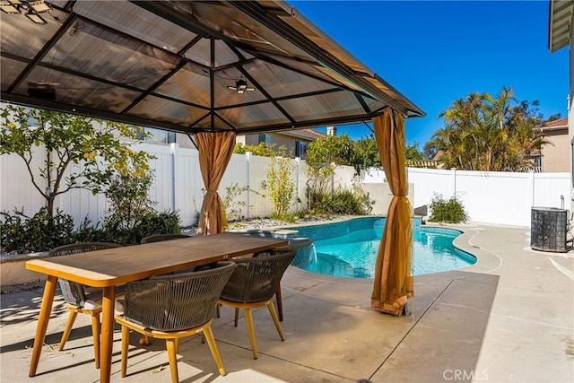 view of swimming pool with a gazebo, a patio area, a fenced backyard, and a fenced in pool