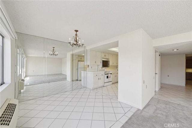 interior space featuring light tile patterned flooring, a notable chandelier, and radiator heating unit