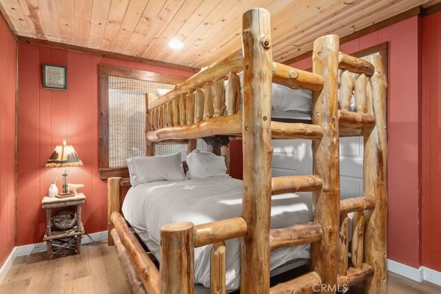 43121 Grizzly Rd, Big Bear Lake, CA 92315 - bedroom featuring wood ceiling, wood finished floors, and baseboards