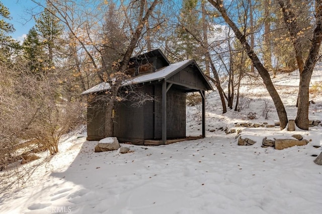 43121 Grizzly Rd, Big Bear Lake, CA 92315 - view of snowy exterior with an outbuilding
