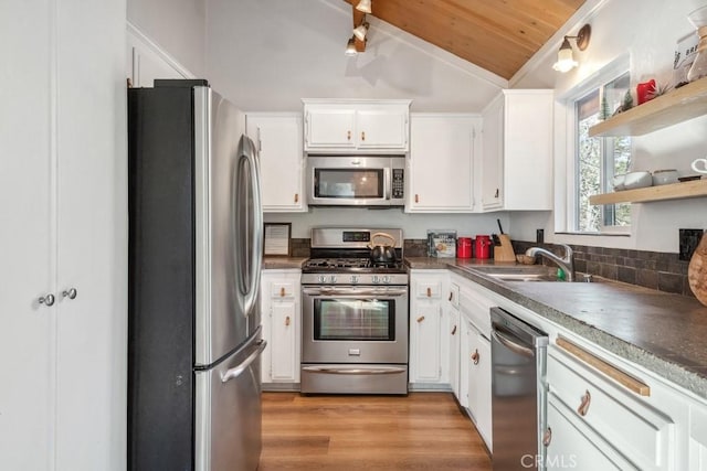 43121 Grizzly Rd, Big Bear Lake, CA 92315 - kitchen with stainless steel appliances, a sink, lofted ceiling, wooden ceiling, and white cabinets
