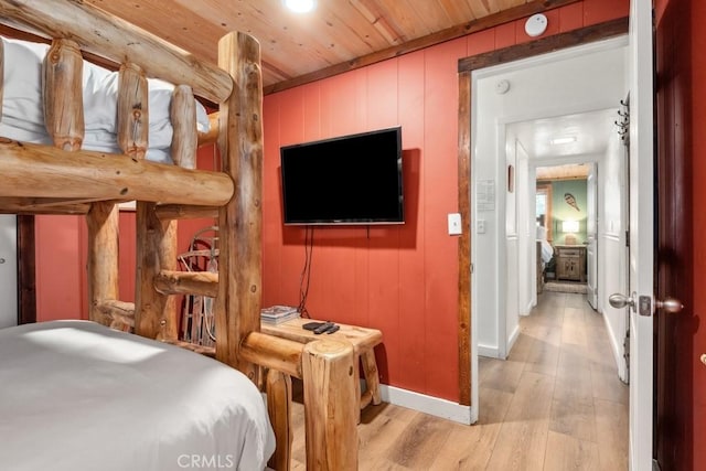 43121 Grizzly Rd, Big Bear Lake, CA 92315 - bedroom with light wood-style floors, wooden ceiling, baseboards, and wooden walls