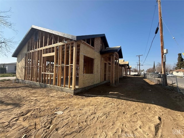 view of property exterior with fence