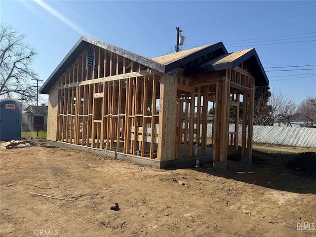 view of home's exterior with fence