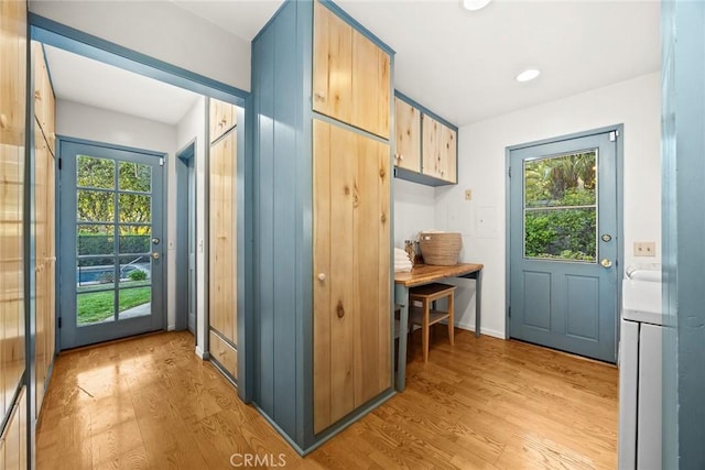 doorway with light wood-style flooring