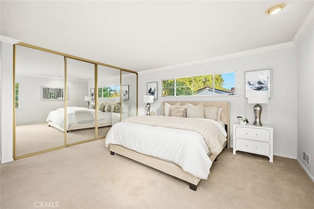 bedroom featuring light carpet, ornamental molding, and visible vents