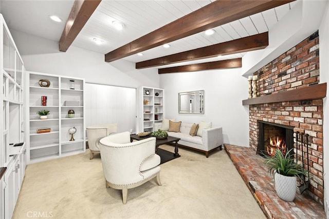 living room with recessed lighting, beamed ceiling, a brick fireplace, and light colored carpet