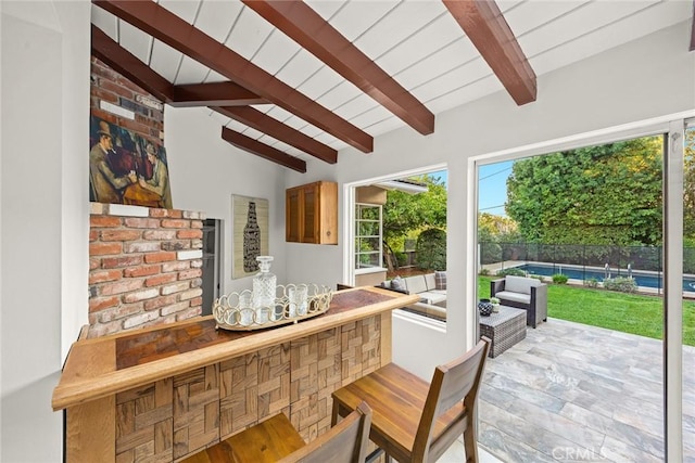 interior space with a fenced in pool, an outdoor bar, and fence