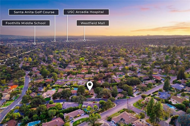 aerial view at dusk with a residential view