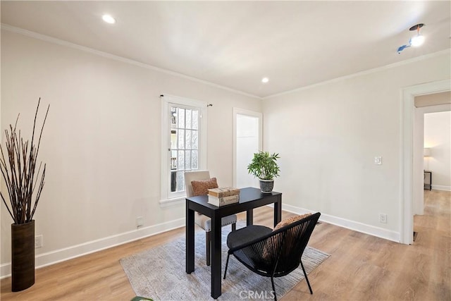 office space featuring light wood-type flooring, baseboards, crown molding, and recessed lighting