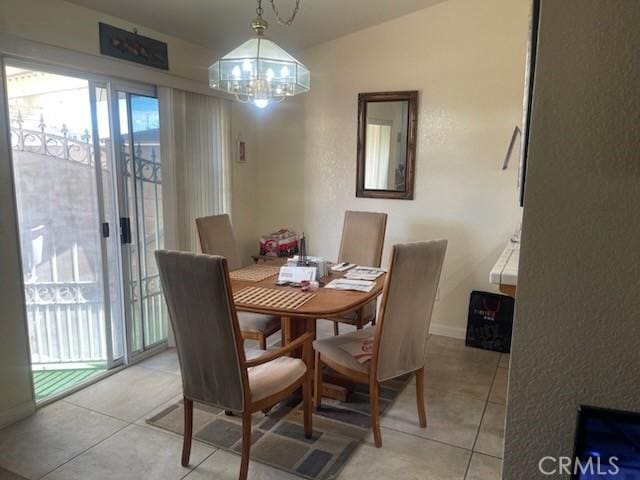 1357 Congress Way, San Jacinto, CA 92583 - dining area featuring vaulted ceiling, light tile patterned flooring, baseboards, and an inviting chandelier