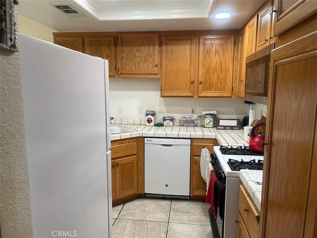 1357 Congress Way, San Jacinto, CA 92583 - kitchen featuring tile countertops, white appliances, and a raised ceiling