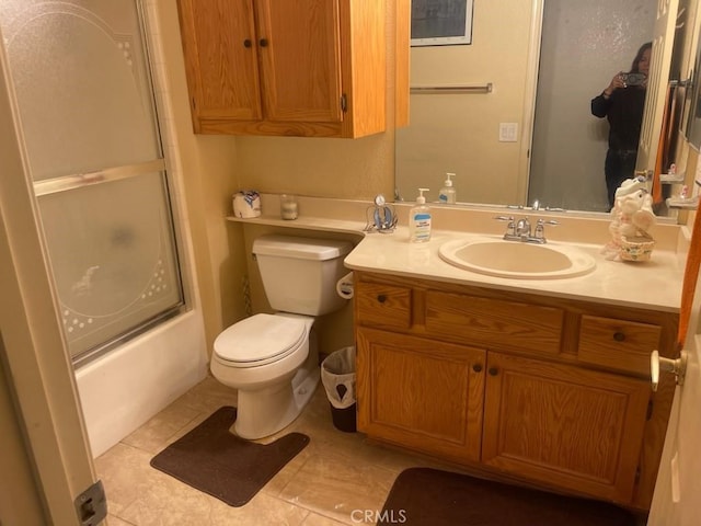 1357 Congress Way, San Jacinto, CA 92583 - full bathroom with tile patterned flooring, combined bath / shower with glass door, vanity, and toilet