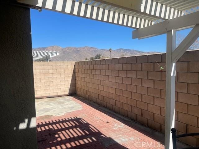 1357 Congress Way, San Jacinto, CA 92583 - view of patio with a mountain view, fence, and a pergola