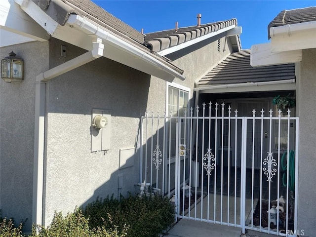 view of gate featuring fence